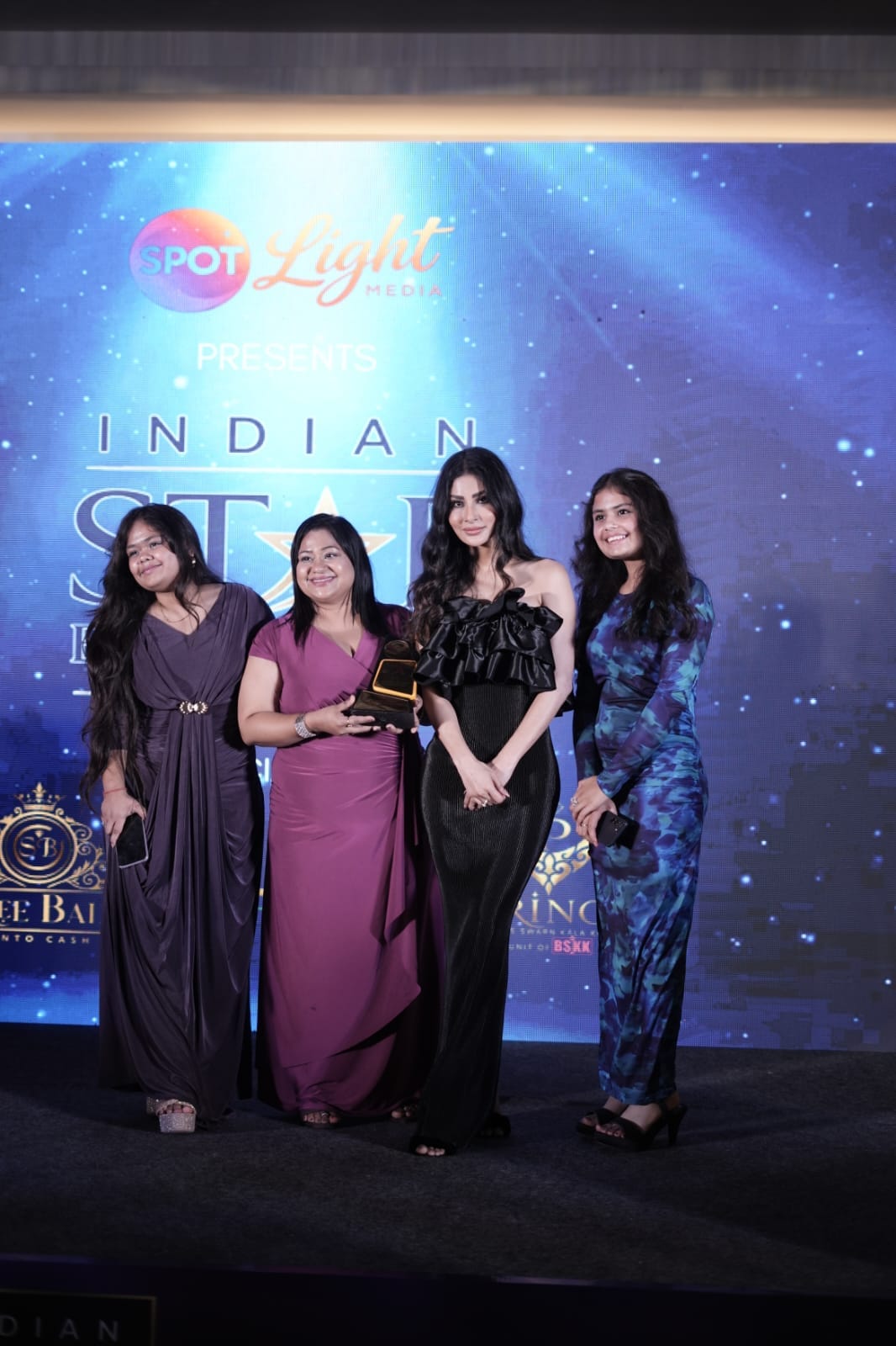 Bollywood Star Mouni Roy conferring Indian Star Excellence Award on grand stage with Dr. Neha Gupta